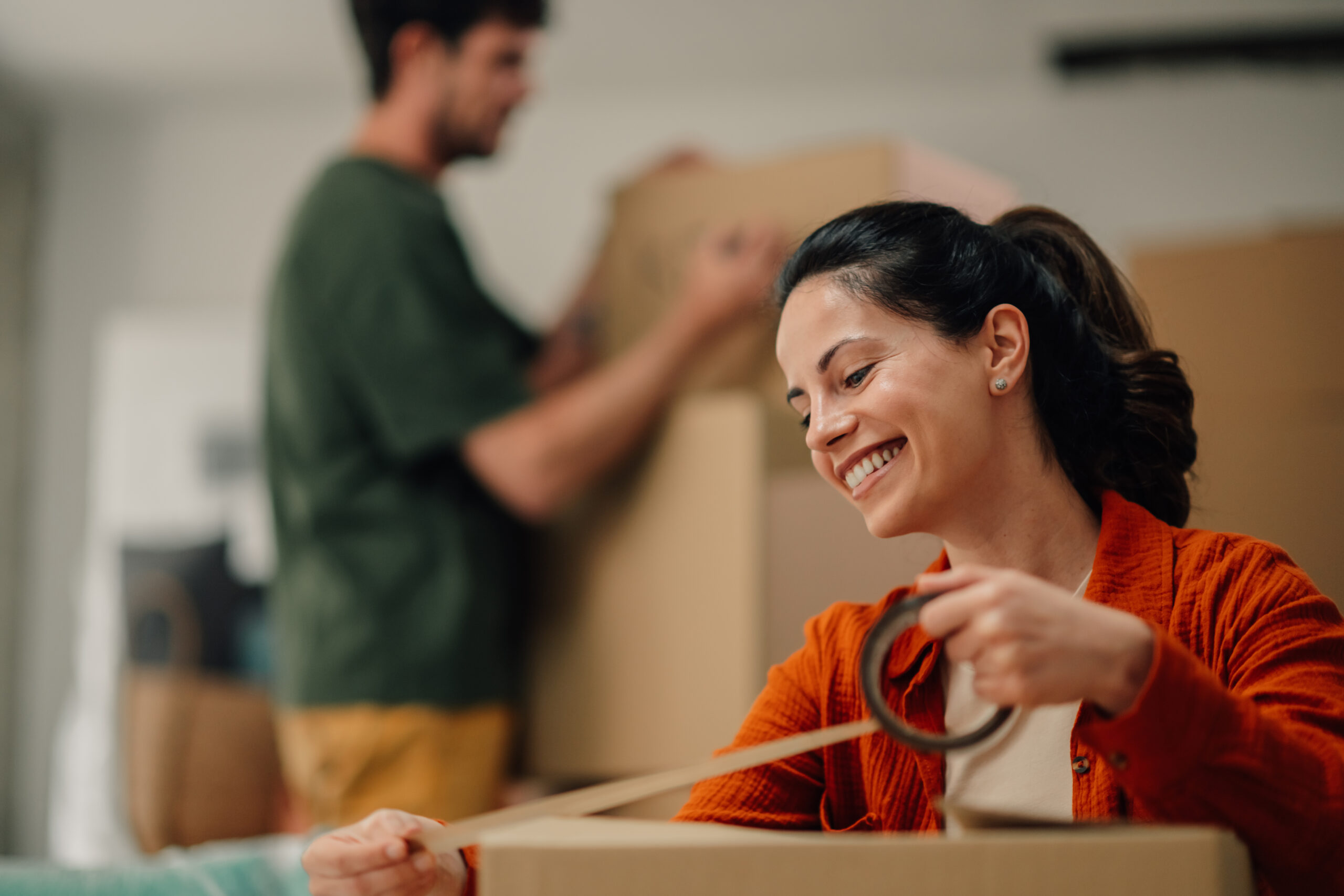Couple packing cardboard boxes for self storage in Worcester